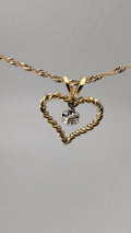 10K Yellow Gold Twisted Heart Pendant with Diamond Accent