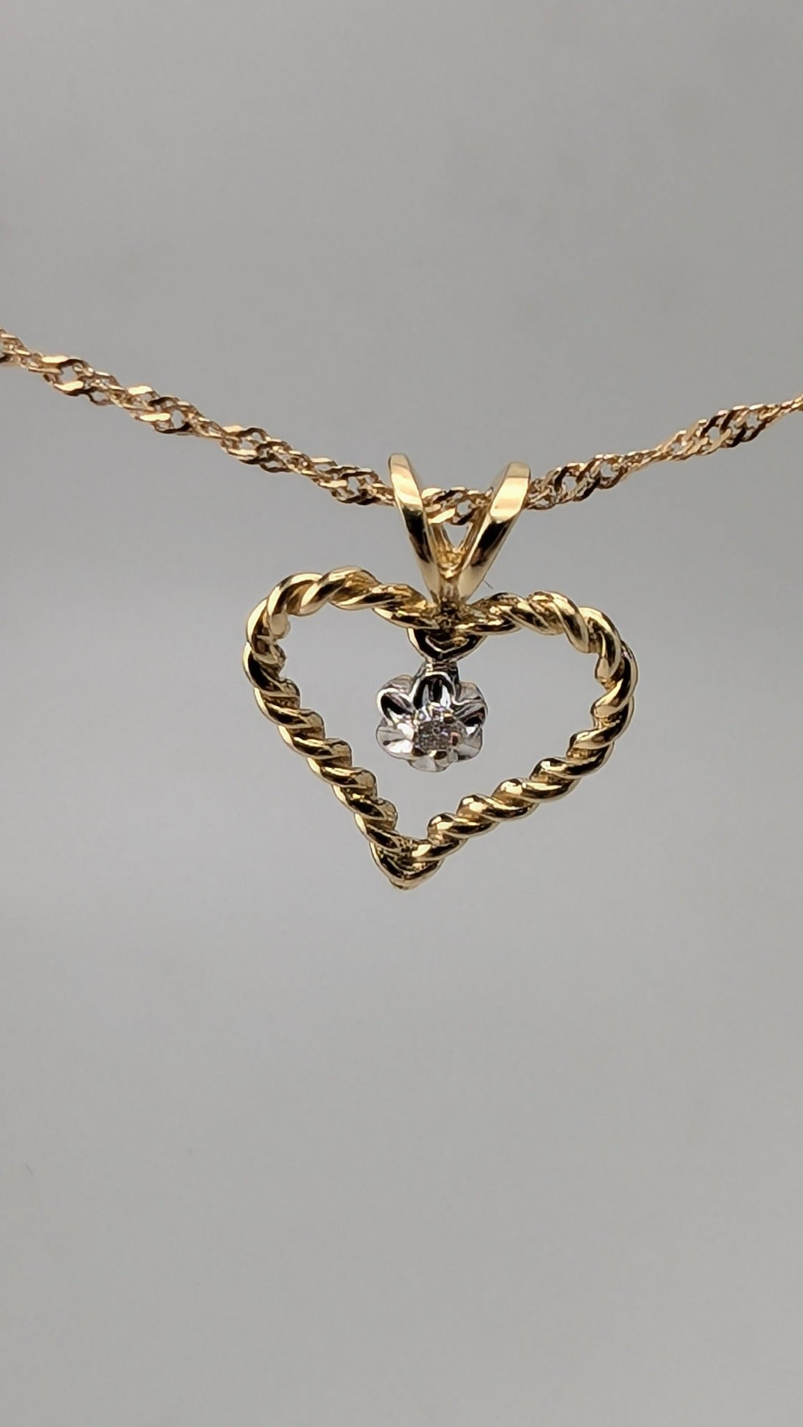 10K Yellow Gold Twisted Heart Pendant with Diamond Accent