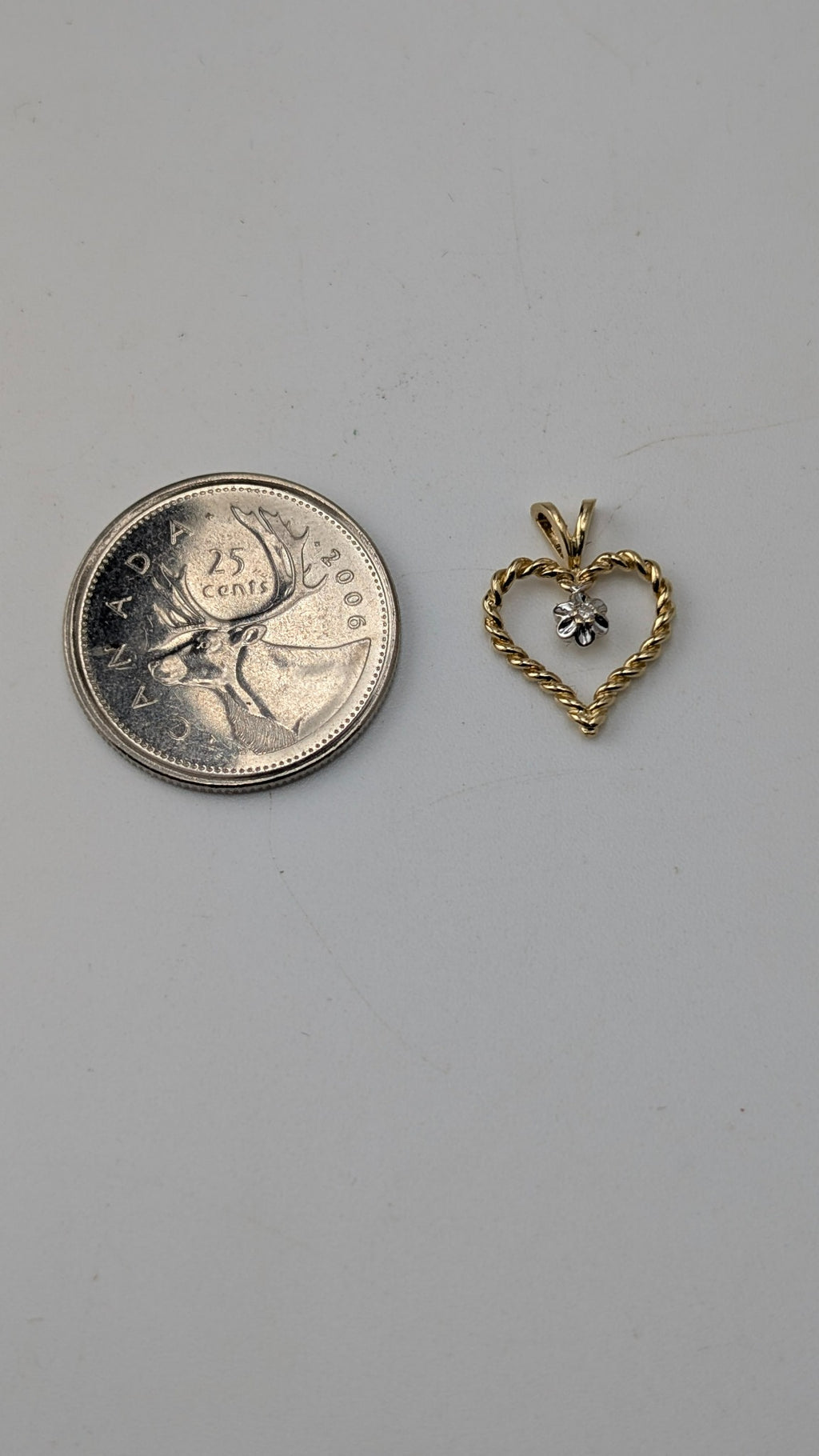 10K Yellow Gold Twisted Heart Pendant with Diamond Accent