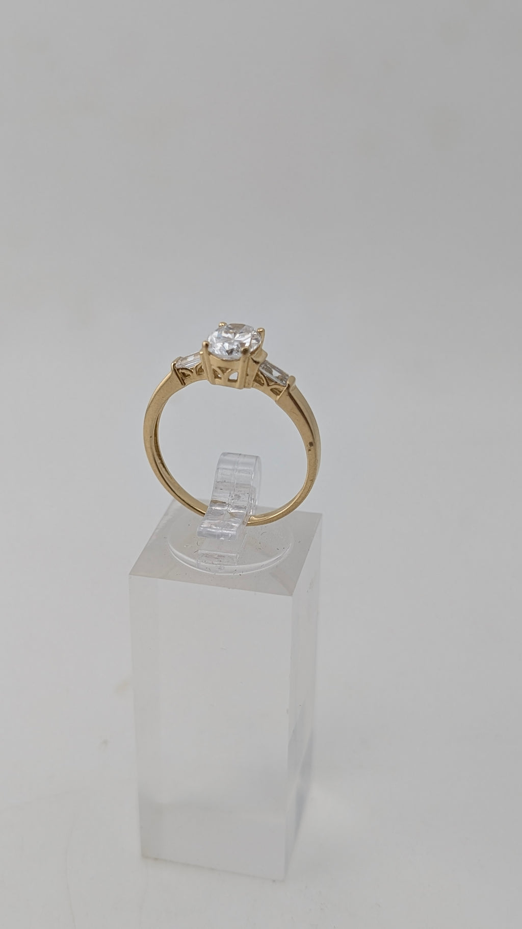 14K Yellow Gold Three-Stone Ring – Oval Simulated Diamond & Baguette Accents
