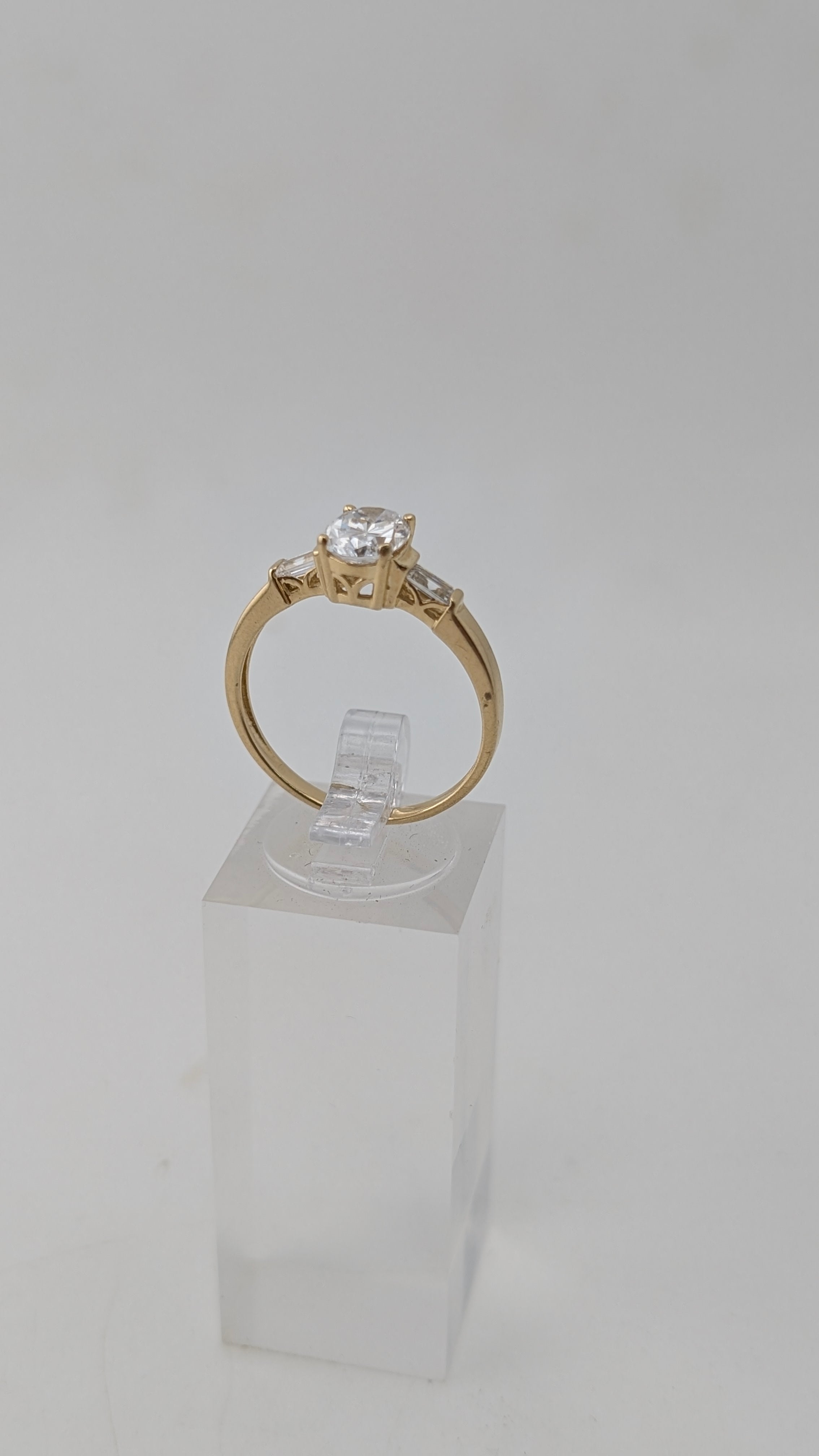 14K Yellow Gold Three-Stone Ring – Oval Simulated Diamond & Baguette Accents