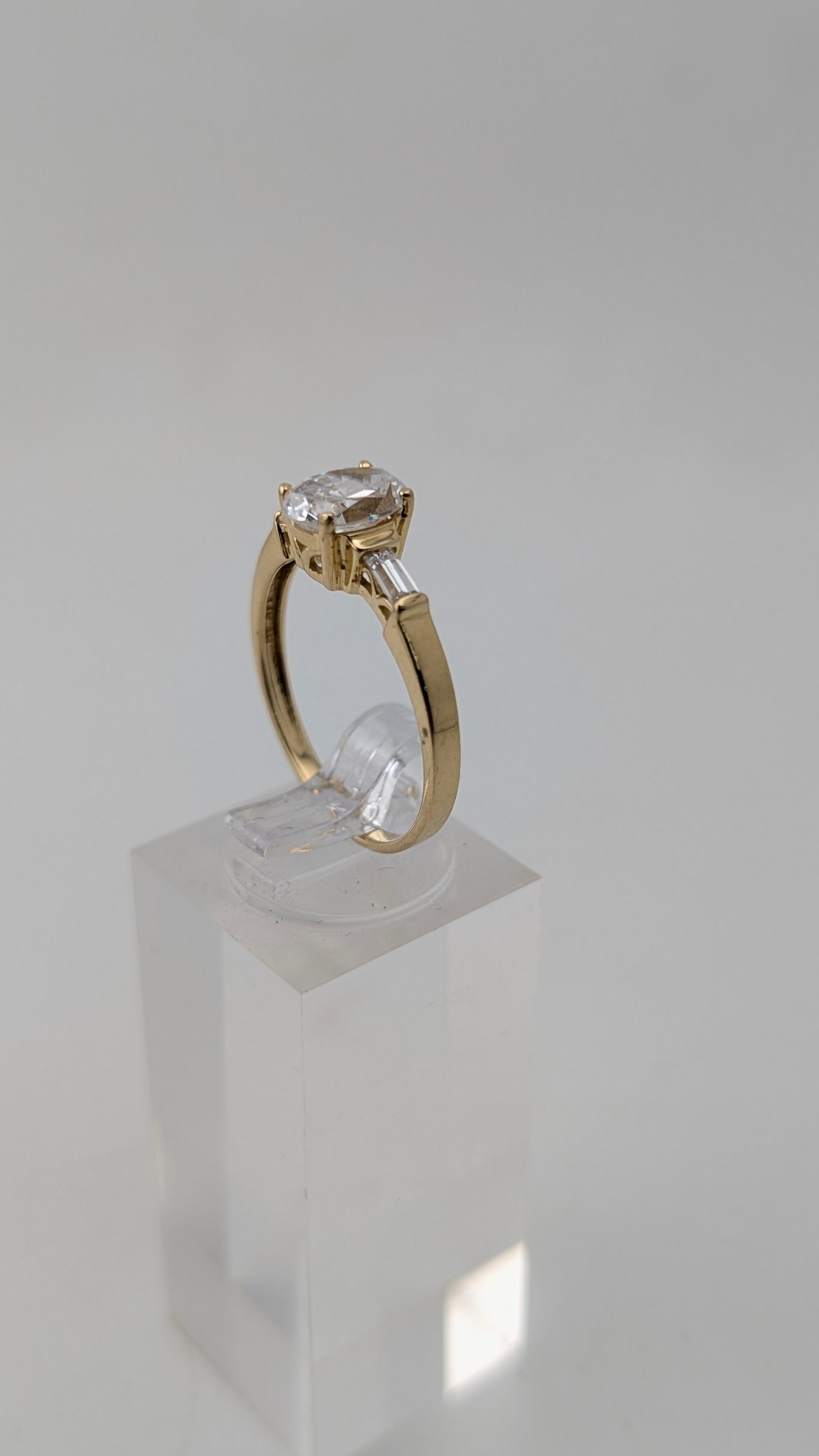 14K Yellow Gold Three-Stone Ring – Oval Simulated Diamond & Baguette Accents