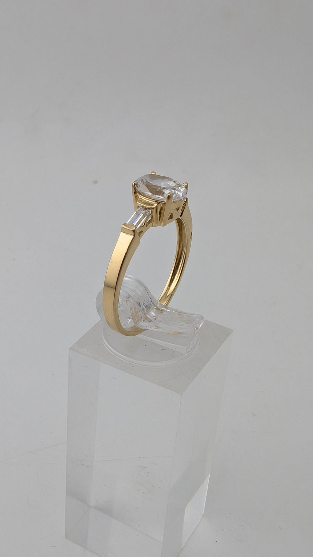 14K Yellow Gold Three-Stone Ring – Oval Simulated Diamond & Baguette Accents