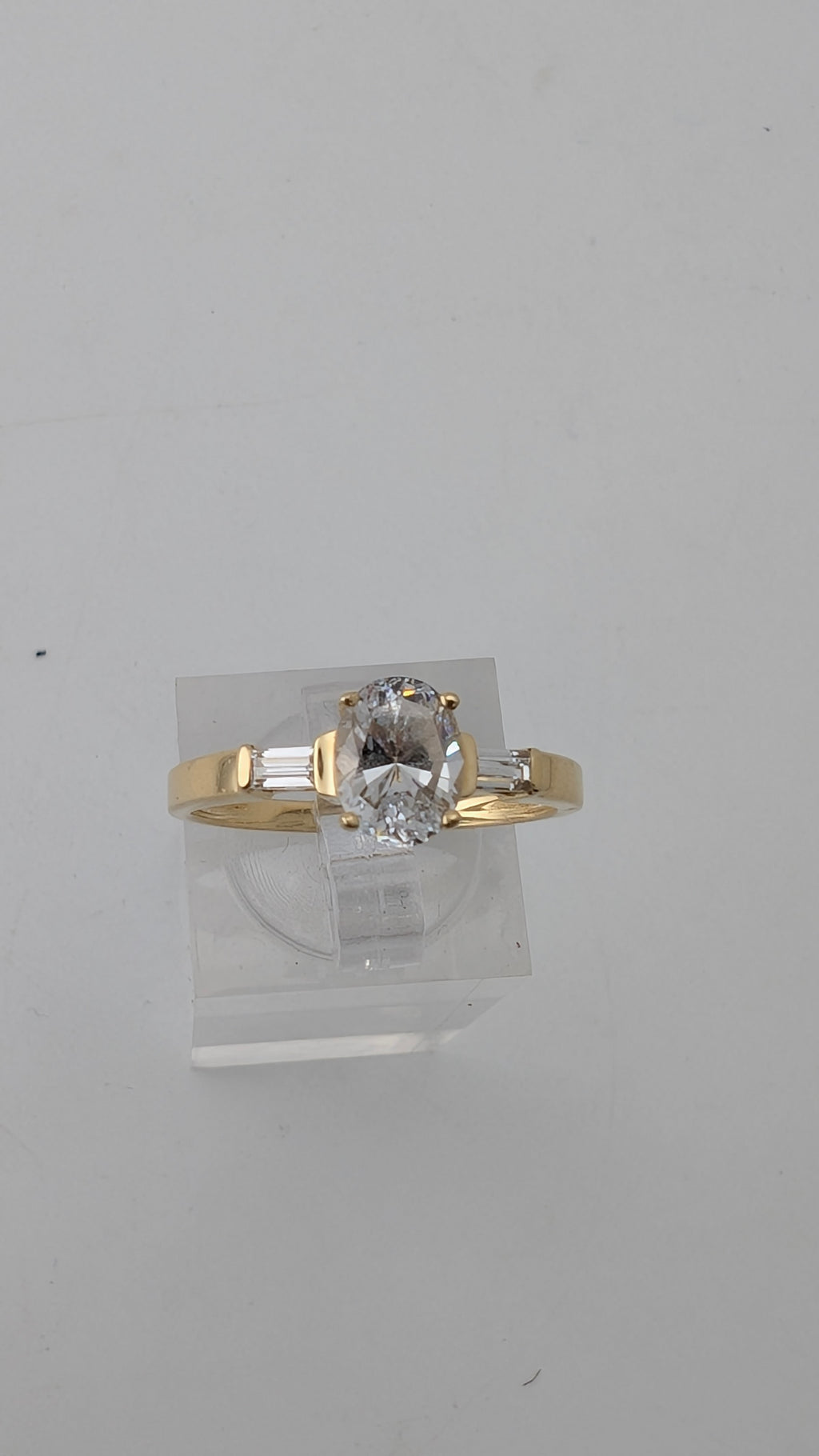 14K Yellow Gold Three-Stone Ring – Oval Simulated Diamond & Baguette Accents